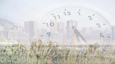 On play clear clock hands rotating clockwise over waterfront and grasses, Stock Footage 328329527