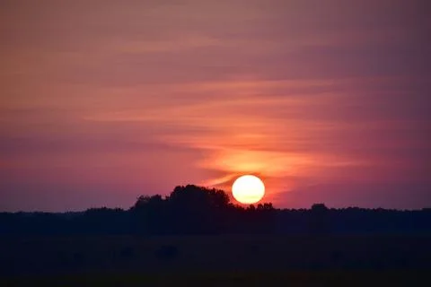 The play of colors in the sky at the time of sunset over the horizon Stock Photos