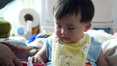 Play is an essential daily routine for a baby's development. Stock Footage 302813922