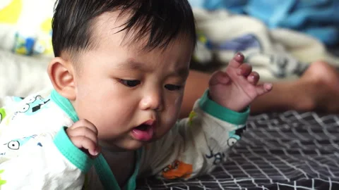 Play is an essential daily routine for a baby's development. Stock Footage 302814484