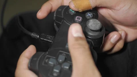 Play games on a console or computer using a controller or joystick Stock Footage 241996114