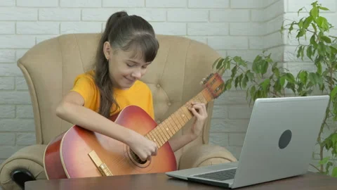 Play the guitar by computer. Stock Footage 151252239