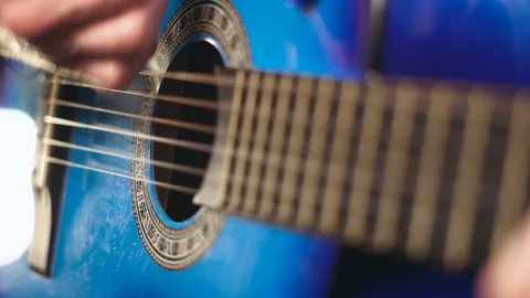To play the guitar with a plectrum Stock Footage 89824964