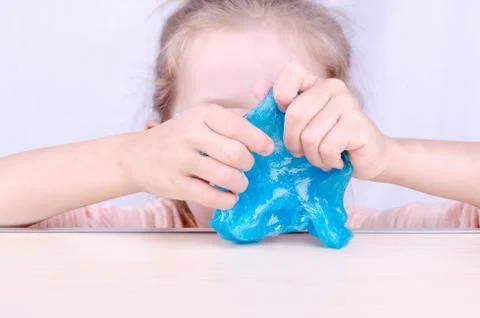 Play with a kid while staying at home quarantine, make slime by yourself. Toy Stock Photos