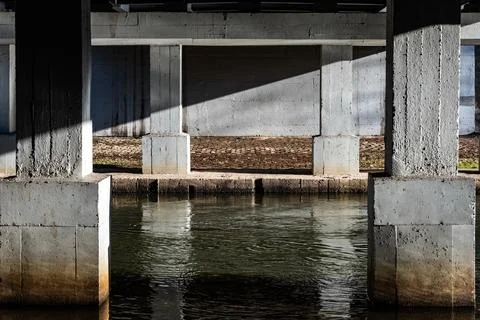 Play of Light and Shadow Under Concrete Bridge 库存照片