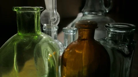 The play of light on multi-colored bottles close-up. Timelapse Stock Footage 117570069