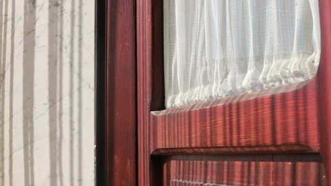 Play of lights and shadows - the light of the sun through a curtain Stock Footage 113229160