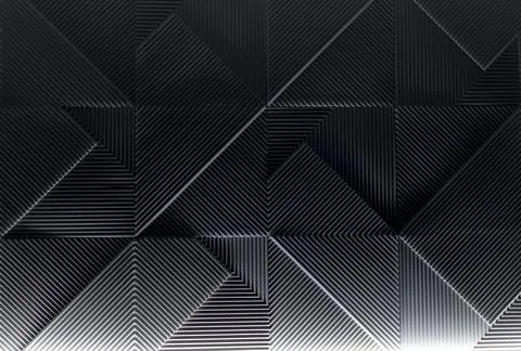 The play of lines of light and shadows on a relief wall Stock Photos