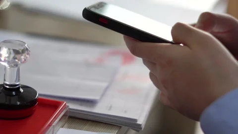 Play mobile phone at work. Stock Footage 155731777