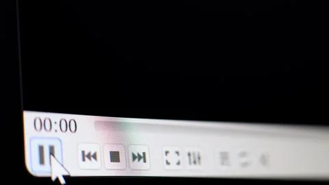 Play pause button press Video player started Camera shot of a computer screen Stock Photos