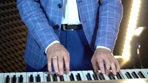 Play the piano in a recording Studio Stock Footage 137883439