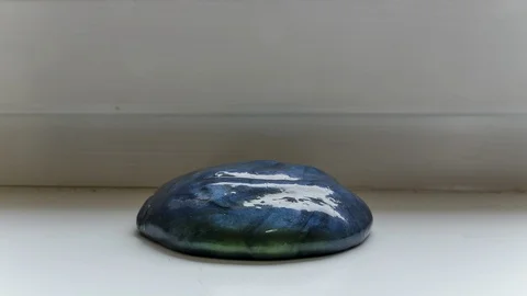 Play Putty Blob Melting in Time-Lapse Stock Footage 121223383