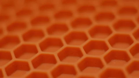 Play of shadows and light. Beautiful orange hexagonal background smoothly rotate Stock Footage 255678933