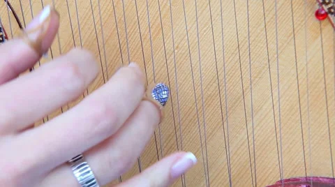 Play on the strings of pandora Stock Footage 58498056