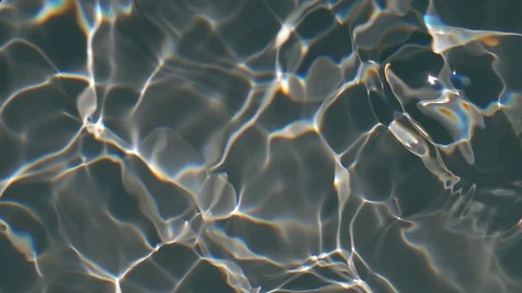 Play of sun light in waving shallow water with gray bottom close up. Stock Footage 96888152