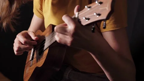 Play ukulele close-up isolated Stock Footage 136455820