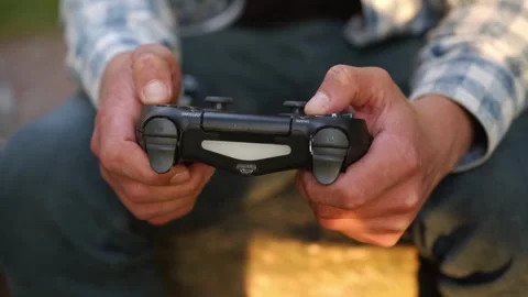 Play the video game theme. Man playing video games holding a joystick Stock-Footage 334653368