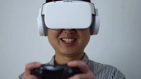 Play vr virtual reality game with Bluetooth handle Stock Footage 154453711