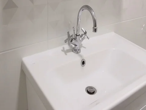 Play with water under Basin Sink Mixer Stock Footage 125802458