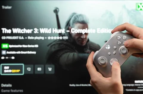 Play The Witcher 3 console game Stock Photos