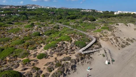 Playa Cabo Pino trails boardwalk aerial landscape Marbella 動画素材 336902853