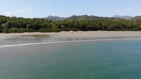 Playa Curu approaching beached boat Stock Footage 127122347