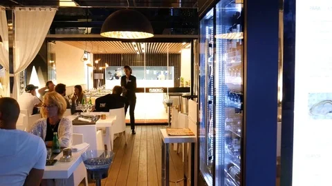Playa de Muro Mallorca Spain: People eating in upscale modern restaurant with Stock Footage 81079662