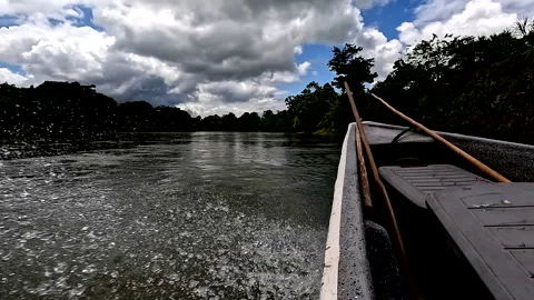 Playa de Oro, Ecuador: 5-12-2022: a small canoe is running with high speed Stock Footage 336911992