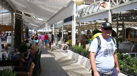 Playa de Palma Mallorca Majorca: People walking and dining on promenade Video stock 63164652