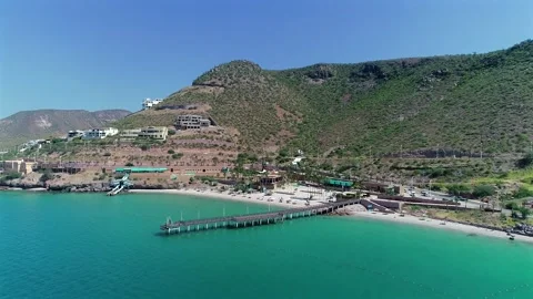 Playa El Coromuel and Hillside Housing Revealed by Backing 4K Aerial Drone Stock Footage 345007273