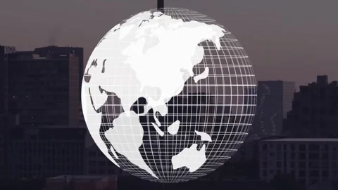 On playback, wireframe globe rotating over city skyline, landmasses shifting Stock Footage 332285910