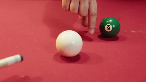 Player carefully forms finger bridge to aim precisely at cue and ball Video stock 329192810