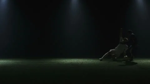 Player does a slide tackle Stock Footage 34274539