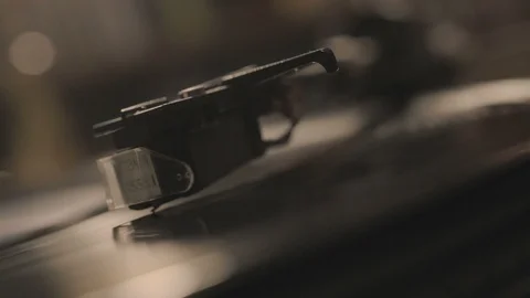 Player, dropping stylus needle on vinyl record playing Stock Footage 121087267