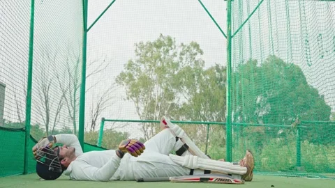 Player falling down after having hard and tough training at the stadium Stock Footage 251645164