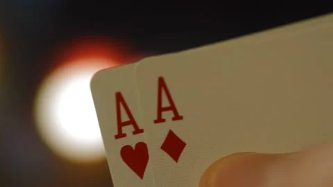 Player hand show two aces for win at poker game. poker card. Stock Footage 227140803