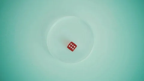 Player hands throwing red dice on the table. Number six. 4k Stock Footage 105574077