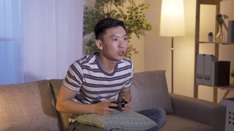 Player having obsession with video games Stock Footage 136748176