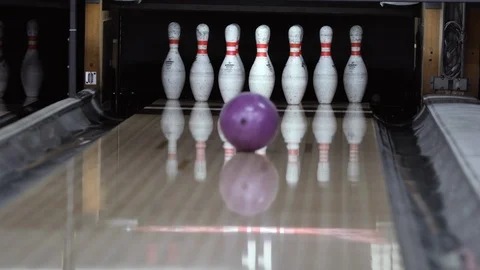 The player knocks out a strike. Game in bowling club. Skittles and bowling ball. Video stock 105713858