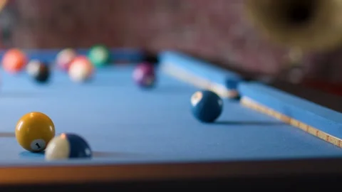 Player Lines Up Shot on Blue Pool Table in Bar Stock Footage 317076796