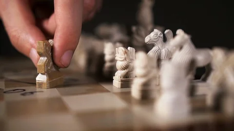 Player move hand pawn form cross on chessboard closeup to opponent piece slow mo Stock Footage 119347803
