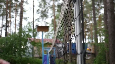 The player passes the ball to the attacker, the guy strikes and hits the net Stock Footage 77575804