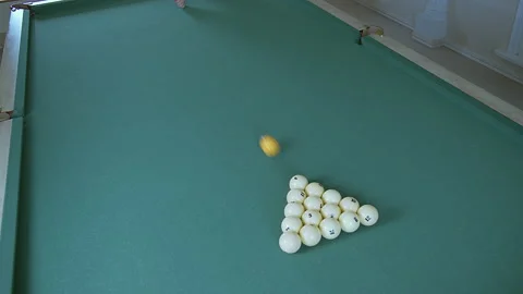 Player plays billiards breaks pyramid of balls Stock Footage 157337779