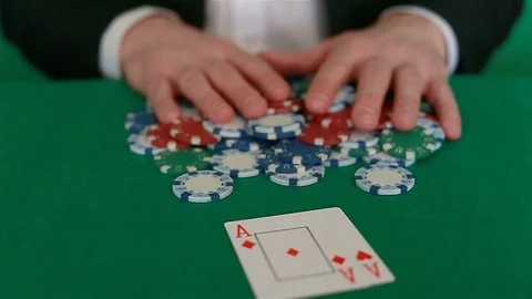 The player puts the cards on the table and takes all the game chips Stock Footage 102646168