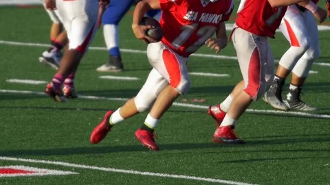 A player scores a touchdown while playing American football, slow motion. Stock Footage 71277570