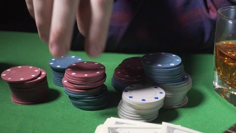 The player takes the chips from the card table Video stock 123293293
