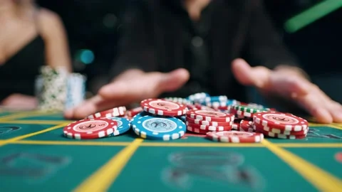Player takes a winning bet in a casino Stock Footage