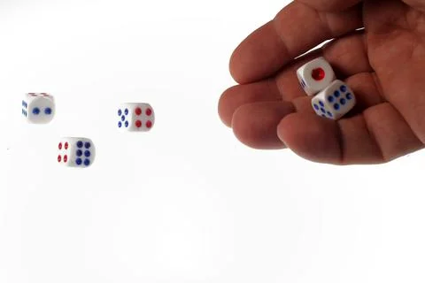 Player throws dice, isolated on white background. Stock Photos