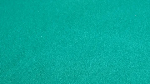 Player throws many red polyhedral dices on green board Stock Footage 106773252