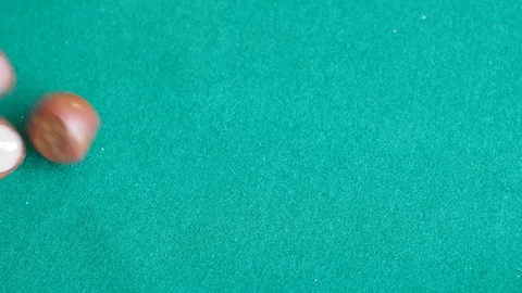 Player throws three wooden dices one time on green board Stock Footage 106772132